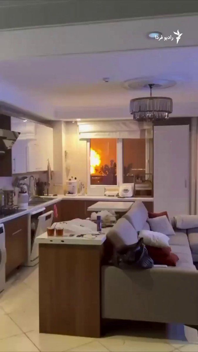 @RadioFarda|راديو فردا: A video published on social media shows the moment of a large explosion in Tehran due to an airstrike, which is said to have been recorded early Saturday morning, March 7, from inside a house in weste