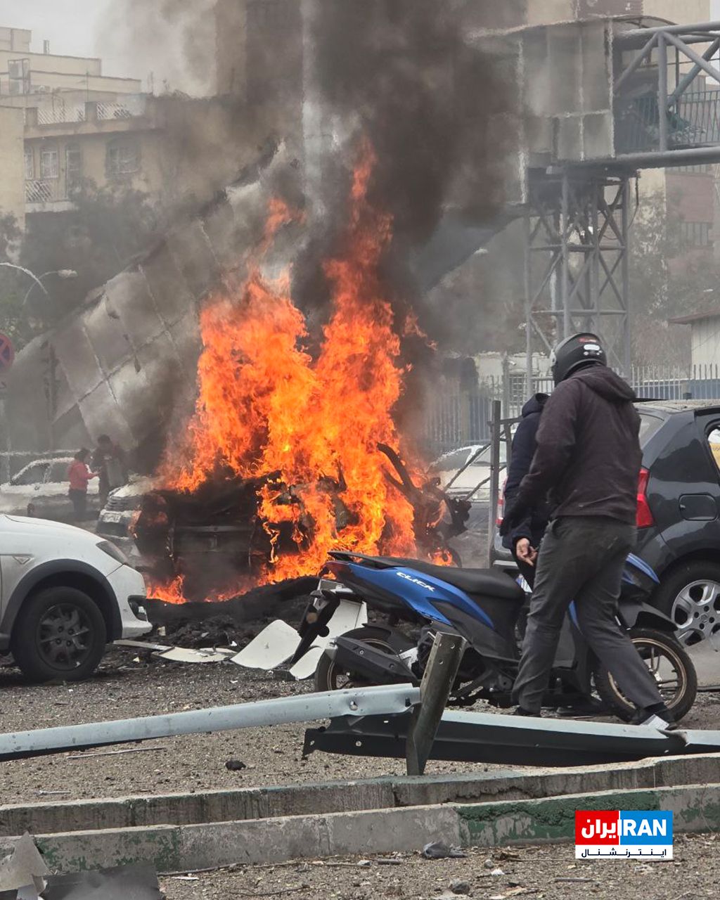 @ايران اينترنشنال: The image received by Iran International shows a fire resulting from the explosion of a vehicle on Tehran’s Bagheri Expressway following a targeted airstrike.