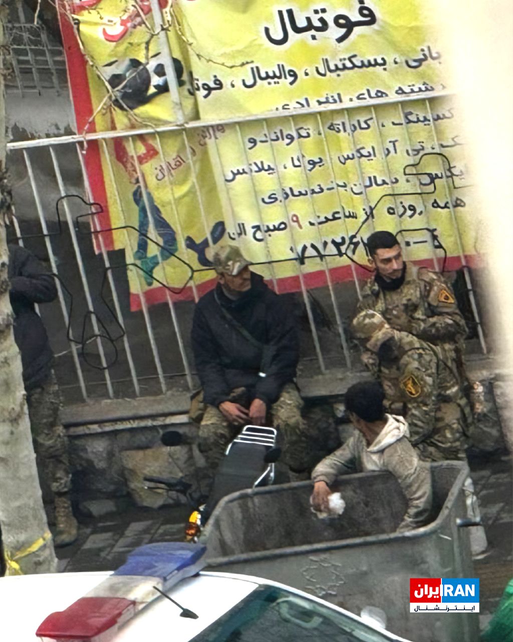 @ايران اينترنشنال: The image sent to Iran International shows Basij agents in Tehran who, with their bases destroyed and out of fear of Israeli drones, have sat down by the roadside.