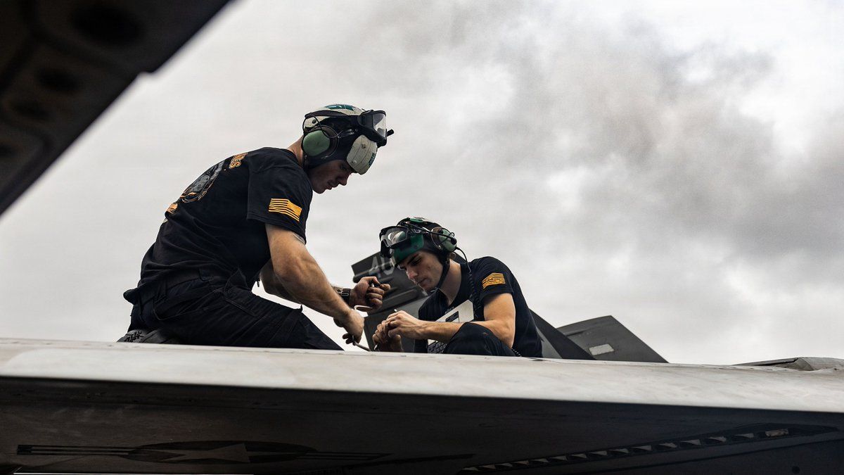 @U.S. Central Command: U.S. Sailors conduct maintenance on F/A-18E Super Hornets on the flight deck of aircraft carrier USS Abraham Lincoln (CVN 72) to ensure carrier strike group assets remain mission ready to enforce the