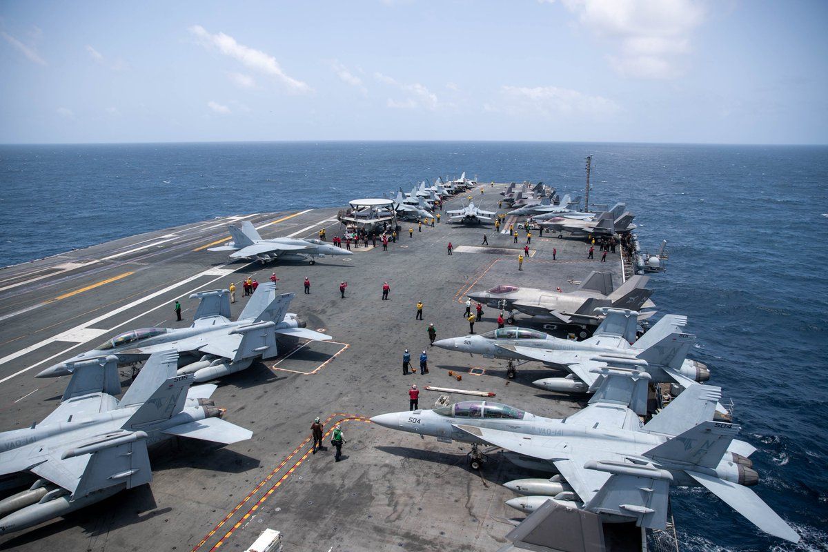 @U.S. Central Command: U.S. Sailors work on the flight deck of USS George Washington (CVN 73), Aug. 20, as the aircraft carrier transits the Arabian Sea. The George Washington Carrier Strike Group is operating in Middle Eas