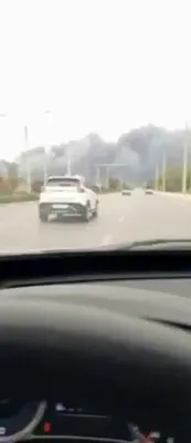 @Babak Taghvaee - The Crisis Watch: A massive airstrike struck an ammunition depot belonging to the IRGC Navy in the city of Bushehr in southwest Iran. In this footage recorded this evening, a large plume of smoke can be seen rising fro