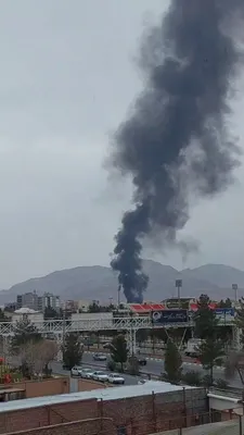 @Babak Taghvaee - The Crisis Watch: BREAKING: Today, the U.S. Navy targeted and destroyed the fuel reserve area of Kerman International Airport in central Iran. You can see a plume of smoke rising as a result of the airstrike at the air