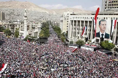 @Mahyar Tousi: Here is a huge pro-Assad rally in Syria before he ran away like a rat to Moscow.

Even he managed to get a bigger crowd than the IRGC in Iran. And he still lost like a bitch.