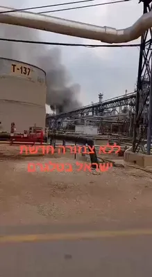 @Babak Taghvaee - The Crisis Watch: BREAKING: The left video shows the fire inside the Bazan oil facilities in Haifa following the ballistic missile attack by the IRGC Aerospace Force. The right CCTV footage shows the moment the missile