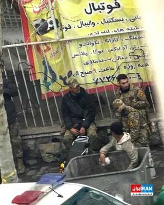 @ايران اينترنشنال: The image sent to Iran International shows Basij agents in Tehran who, with their bases destroyed and out of fear of Israeli drones, have sat down by the roadside.