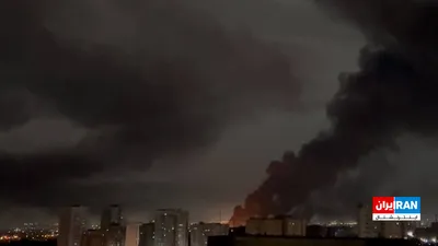 @ايران اينترنشنال: An image received by Iran International on Thursday, the sixth of Farvardin, shows black smoke rising from a massive explosion in the Ansar Garrison of the IRGC in Tehranpars, Tehran.