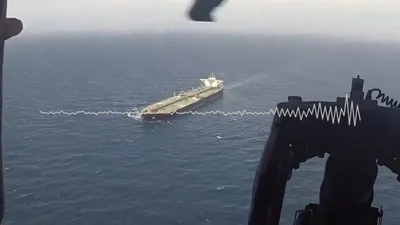 @U.S. Central Command: Audio🔊of a Sailor aboard USS Michael Murphy (DDG 112), with video from the guided-missile destroyer’s embarked helicopter flying over the Gulf of Oman, as the U.S. Navy diverts a merchant vessel whil