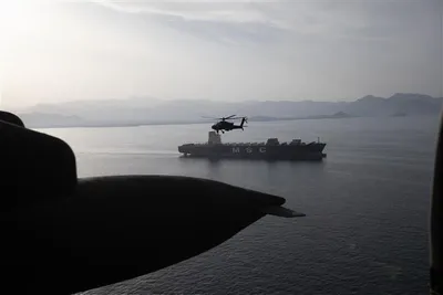 @U.S. Central Command: AH-64 Apaches fly above the Strait of Hormuz during a patrol, April 17. U.S. Army Soldiers are flying in and around the strait providing a visible presence in support of freedom of navigation.