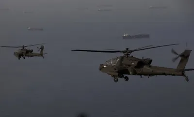 @WarMonitor🇺🇦🇬🇧: US airforce AH-64 Apaches pictured operating over the Strait of Hormuz.