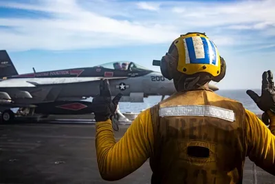 @Open Source Intel: U.S. Central Command (CENTCOM):

"A U.S. Sailor signals to an F/A-18E Super Hornet as it prepares to launch from the flight deck of USS Abraham Lincoln (CVN 72) during U.S. naval blockade operations i
