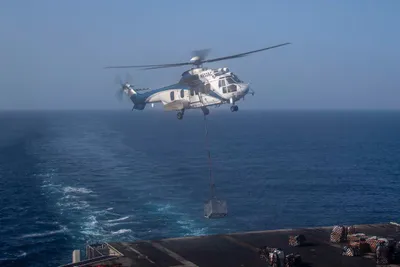 @U.S. Central Command: Aircraft carrier USS Abraham Lincoln (CVN 72) receives supplies during a vertical replenishment in the Arabian Sea with supply ship USNS Carl Brashear (T-AKE 7), April 18. Abraham Lincoln is currently