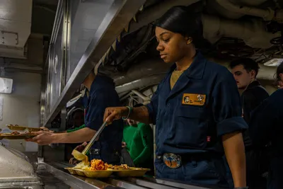 @U.S. Central Command: Sailors aboard aircraft carrier USS Abraham Lincoln (CVN 72) serve meals to crew members. A typical aircraft carrier strike group serves around 4,000 eggs daily.

Three aircraft carrier strike groups 