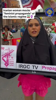 @Visegrád 24: An Iranian woman mocks the hypocrisy of the "feminist propaganda" of the Islamic regime by wearing a hijab and a TV frame saying IRGC TV propaganda. 

Recently, there were massive women-only rallies i