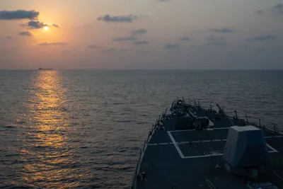 @U.S. Central Command: Guided-missile destroyer USS Pinckney (DDG 91) observes a merchant vessel while on patrol enforcing the U.S. blockade against Iran. As of today, 50 commercial vessels have been redirected by U.S. forc