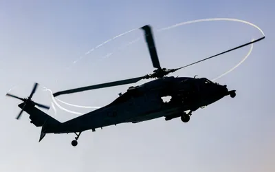 @U.S. Central Command: An MH-60 Sea Hawk helicopter takes off from amphibious assault ship USS Tripoli (LHA 7) in the Arabian Sea. Sea Hawks are playing an essential role enforcing the U.S. naval blockade against Iran.