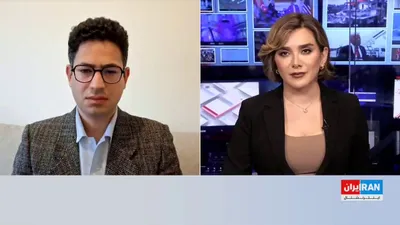 @ايران اينترنشنال: Some presenters from the Islamic Republic of Iran's state television appeared on live TV programs with guns. On Ofogh network, affiliated with the IRGC, a masked military personnel demonstrated how to