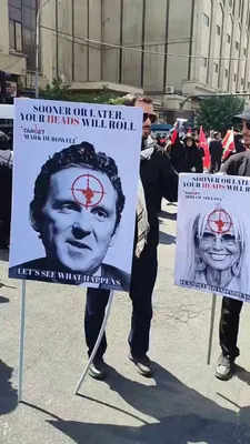 @Open Source Intel: At Khamenei's funeral in Tehran, signs displayed Trump, Ben Shapiro, Laura Loomer, Miriam Adelson, Lindsey Graham and others with red targets over their faces.

The text read: "In the end, your heads 