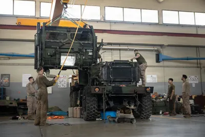 @U.S. Central Command: U.S. Marines change the transmission on a High Mobility Artillery Rocket System vehicle while deployed to the Middle East. American military logisticians and sustainers across CENTCOM remain at the to