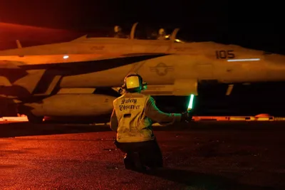 @Open Source Intel: U.S. CENTCOM: ‘U.S. Sailors signal an F/A-18E Super Hornet on the deck of USS George H.W. Bush (CVN 77) as the aircraft carrier transits the Arabian Sea. The F/A-18E is a multirole fighter jet capable