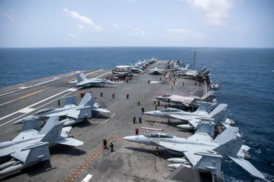 @U.S. Central Command: U.S. Sailors work on the flight deck of USS George Washington (CVN 73), Aug. 20, as the aircraft carrier transits the Arabian Sea. The George Washington Carrier Strike Group is operating in Middle Eas