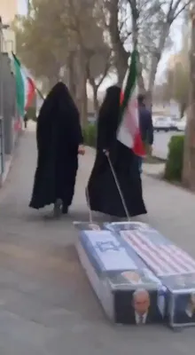 @Masih Alinejad: They have put Trump and Netanyahu in coffins, portraying them as dead bodies and dragging the coffins through the streets.

These two women are Basij supporters taking part in a government-organized r