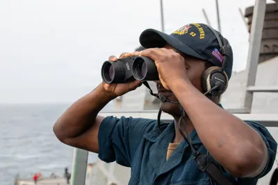 @U.S. Central Command: A U.S. Sailor stands watch aboard USS John Paul Jones (DDG 53). As of Sept. 20, CENTCOM forces have redirected 109 commercial vessels to ensure total compliance.