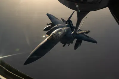 CENTCOM: A U.S. Air Force F-15E Strike Eagle is refueled by a KC-135 Stratotanker while patrolling the skies over the Middle East.