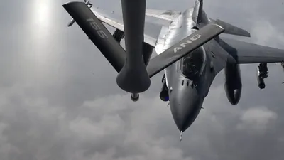 U.S. Central Command (CENTCOM): "A U.S. Air Force F-16 fighter jet is refueled by a KC-135 Stratotanker during a mission in the Middle East."